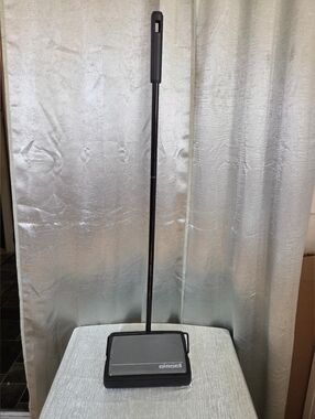 Bissell Cordless Floor Sweeper in Black and Silver.